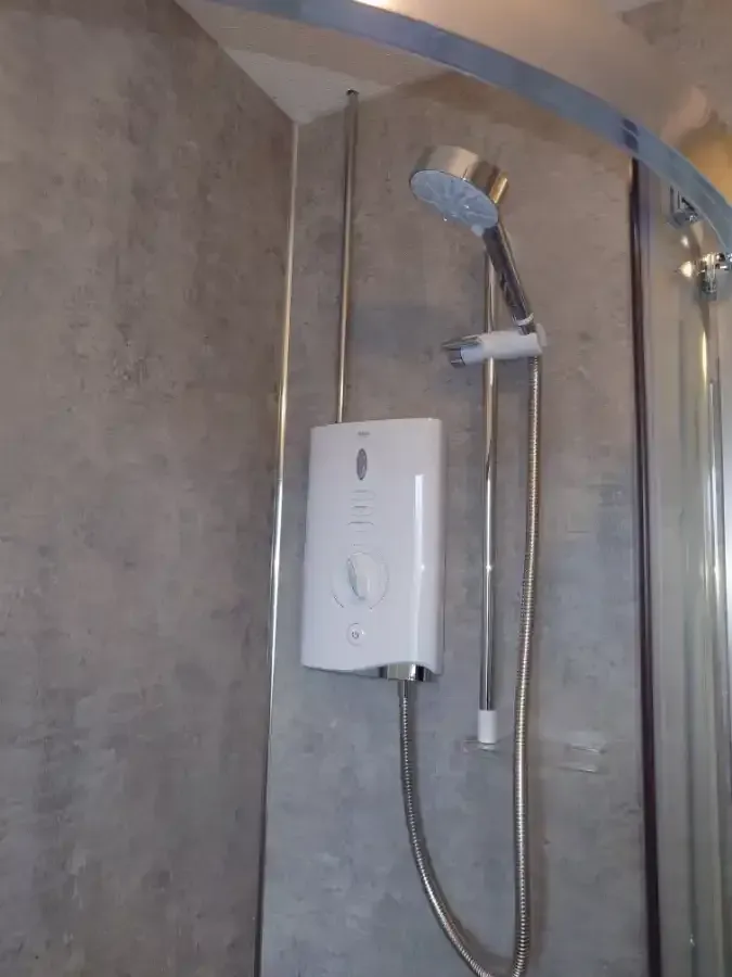 Freestanding bath installation in a modern bathroom by Exeter plumbers