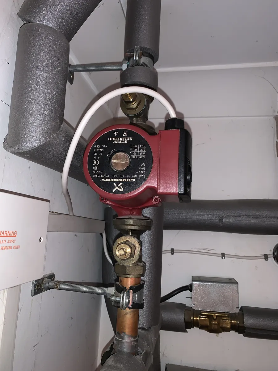 Grundfos heating pump and valves in an airing cupboard, Exeter