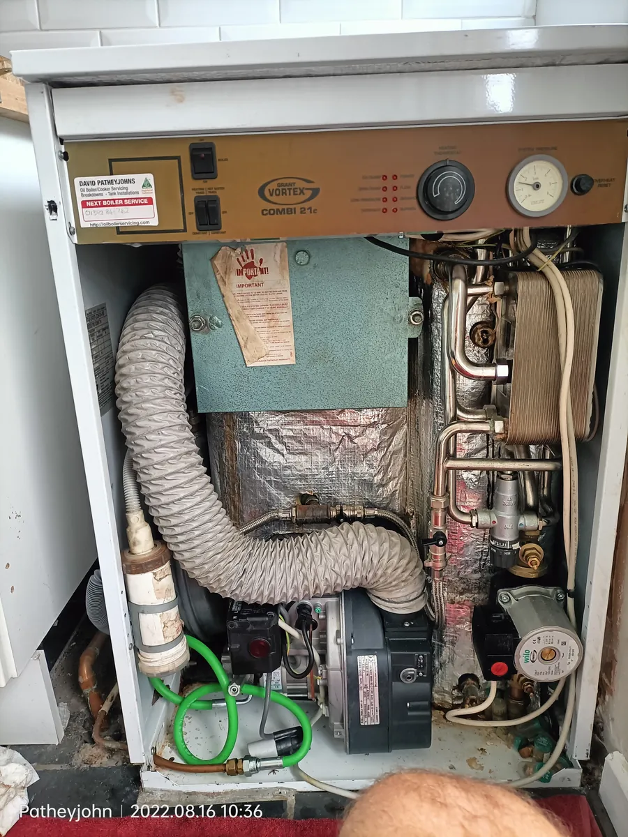 Grant oil boiler with the casing off during an annual service in Exeter