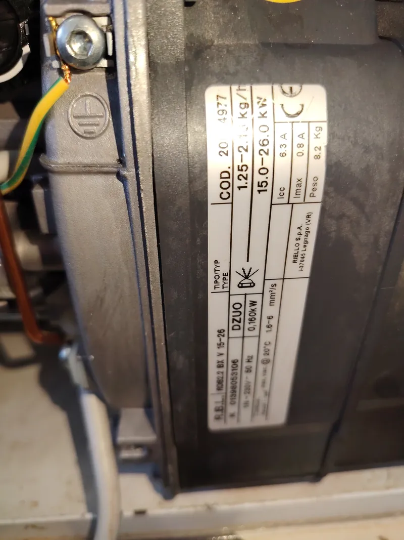 Riello RDB 2.2 BX burner data plate showing a 15 to 26 kW output range, fitted to a Grant Vortex Pro boiler