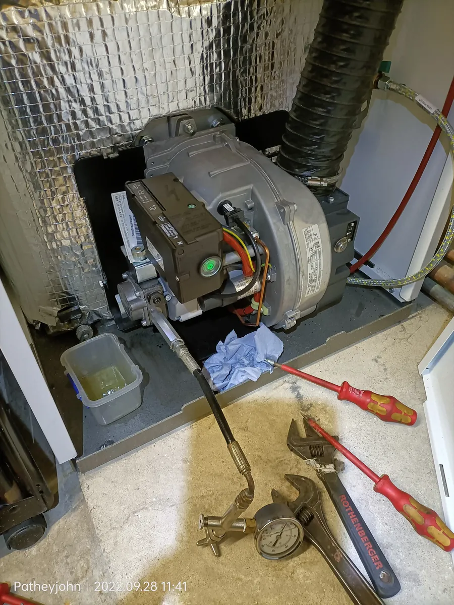 Riello oil burner removed for cleaning during a service in Exeter