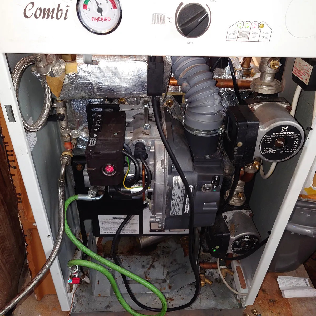 Worcester Heatslave oil combi boiler with the front off during a service in Exeter