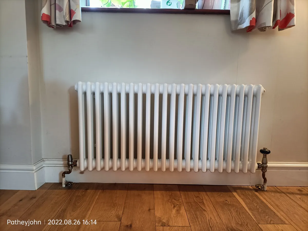 White horizontal column radiator installed in an Exeter home