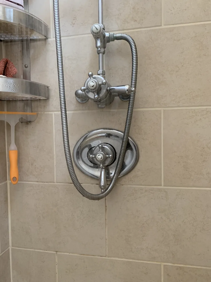 Exposed shower valve and riser rail in an Exeter bathroom