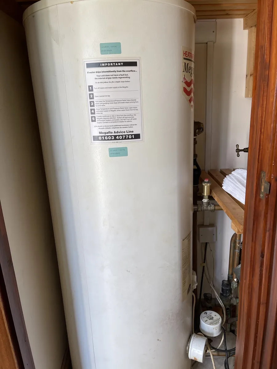 Unvented hot water cylinder in a cupboard, Exeter